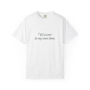 White T-shirt with black cursive text reading 'I bloom in my own time'.