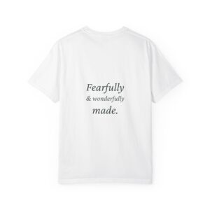 Back view of a white T-shirt with the phrase 'Fearfully & wonderfully made' printed in script typography.