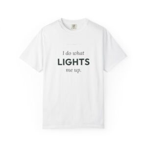 White T-shirt with a printed slogan reading “I do what lights me up.” close-up of chest area.