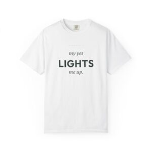 White t‑shirt laid flat showing bold black text centered on the chest: 'my yes LIGHTS me up.'