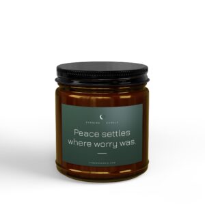 Close-up of a dark amber jar with a black screw-top lid and a green label showing 'Peace settles'.