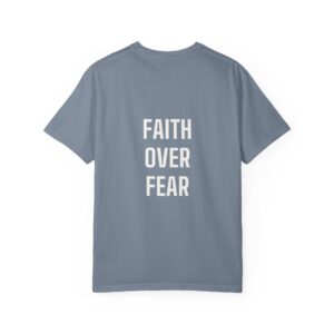 Back view of a blue T-shirt with large vertical white text reading 'FEAR' on multiple lines.
